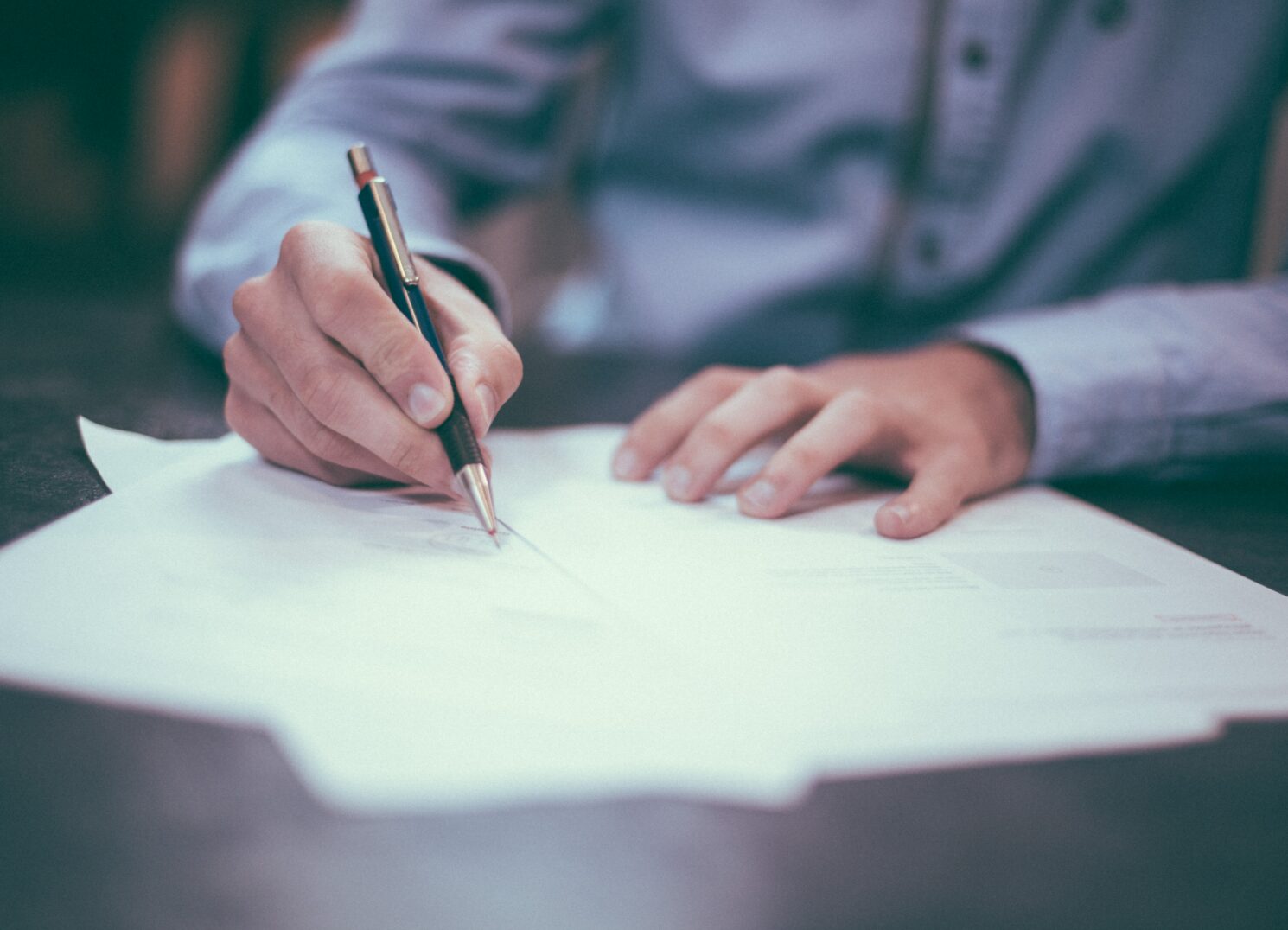 Man signing documents